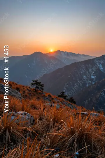 Mountain Range at Sunrise with Snow-Capped Peaks