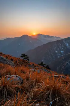 Mountain Range at Sunrise with Snow-Capped Peaks
