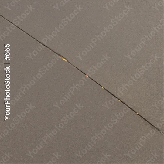 Minimalist Fishing Line with Floating Yellow Dots on concrete