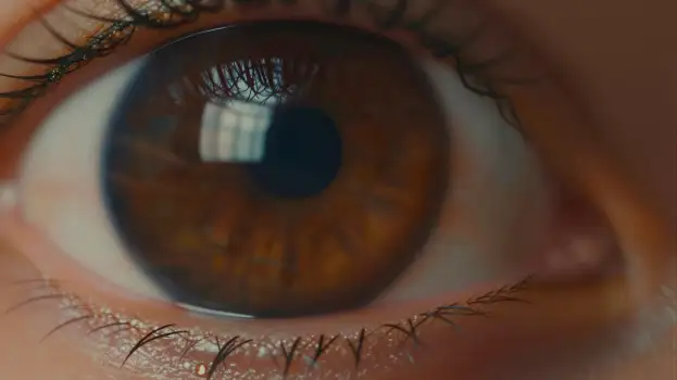 Close-up of a person's eye with detailed iris and pupil