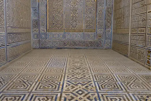 Empty Room with Blue and White Geometric Tiles