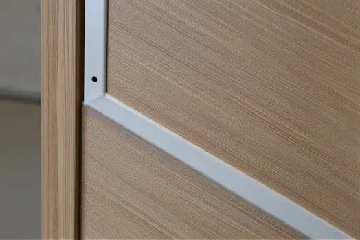 Wooden Door with Metal Frame Close-Up textured wood