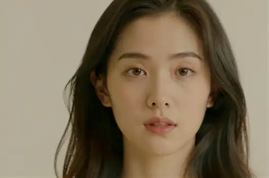 Young Woman with Loose Waves Looking Serious portrait