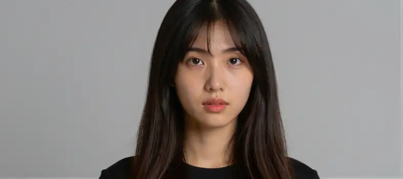 Serious Young Woman with Long Dark Hair Looking Directly at Camera asian woman