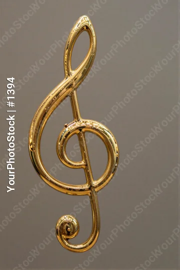 Gold Treble Clef Musical Symbol intricate spiral design