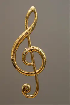 Gold Treble Clef Musical Symbol intricate spiral design