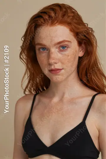 Young Woman with Red Hair in Bikini Top serious expression model