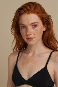 Young Woman with Red Hair in Bikini Top serious expression model