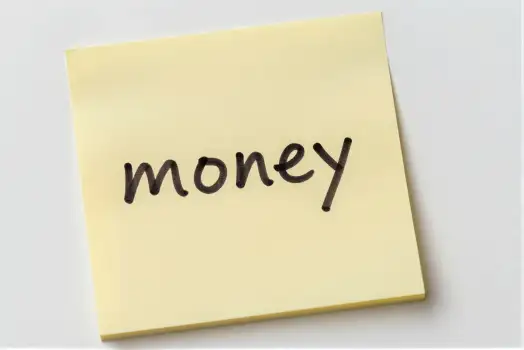 Yellow Sticky Note with Money Written on It finance