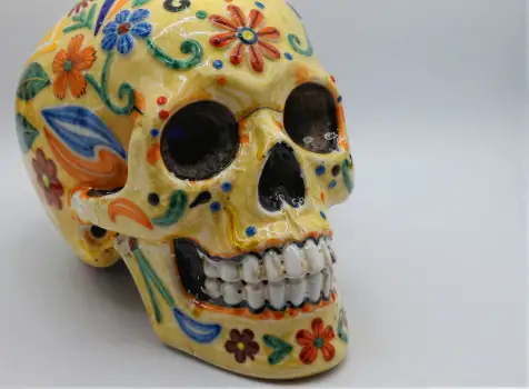 Bright Yellow Skull Figurine with Floral Designs mexico