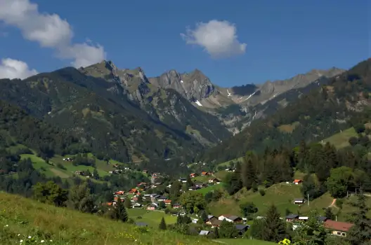 Mountainous Landscape with Blue Sky and Green Trees