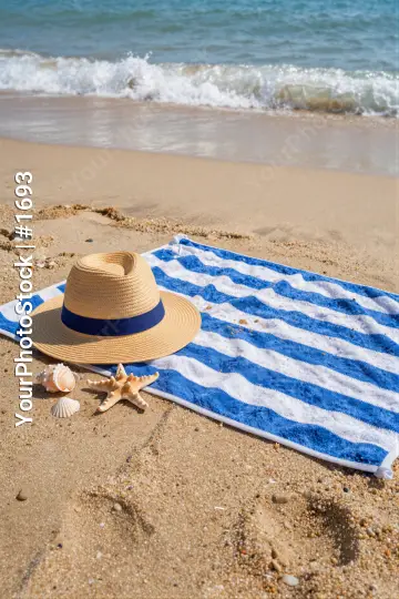 Beach Scene with Striped Towel and Seashells straw hat
