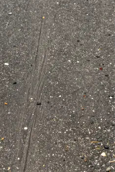 Wet Asphalt Road with Diagonal Line construction texture