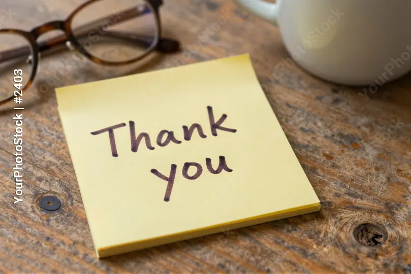 Thank You Note on Wooden Table sticky note glasses