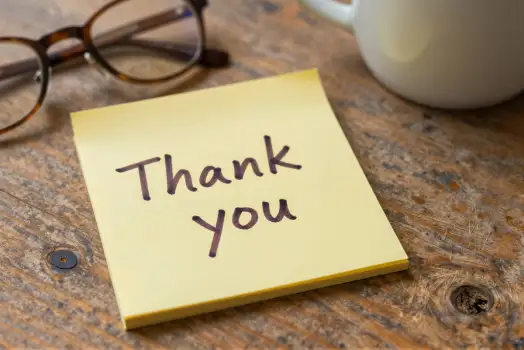Thank You Note on Wooden Table sticky note glasses