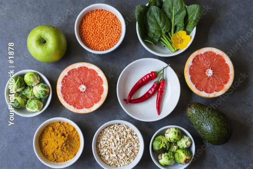 Circular Flat Lay of Fruits and Vegetables on Dark Grey Background