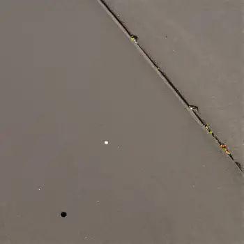 Aerial View of Grayish-Brown Water with Floating Objects
