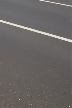 Empty Parking Lot with White Lines and Dots surface