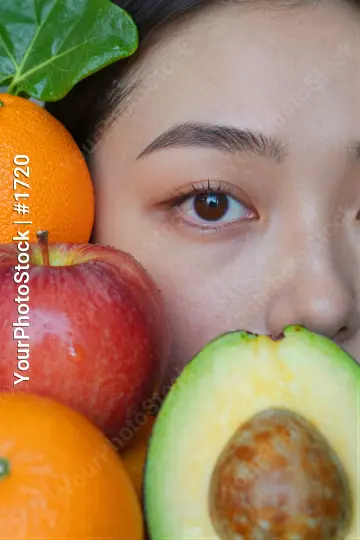 Young Woman Smiling with Fruits apple orange avocado
