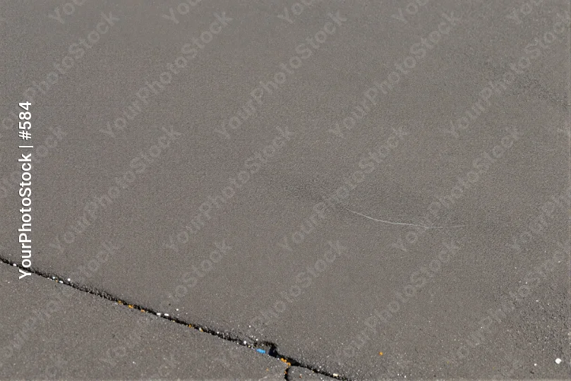 Close-up of Gray Surface with Textured Black Line and Blue Dot concrete