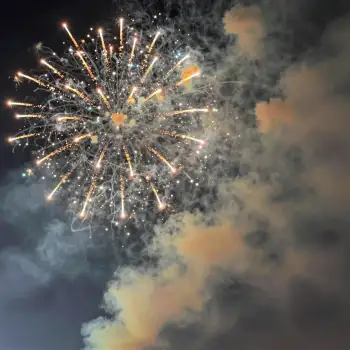Fireworks Display Over Cloudy Sky flower shape in the night festival