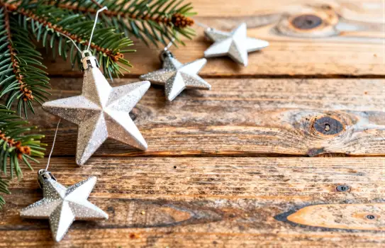 Rustic Wooden Background with Pine Branches and Stars for Crafting
