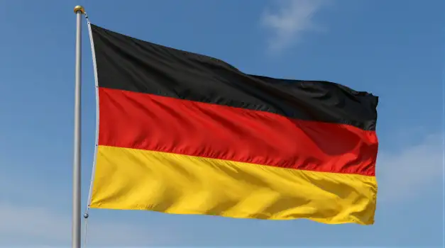 High-flying German Flag Against Clear Sky black red yellow