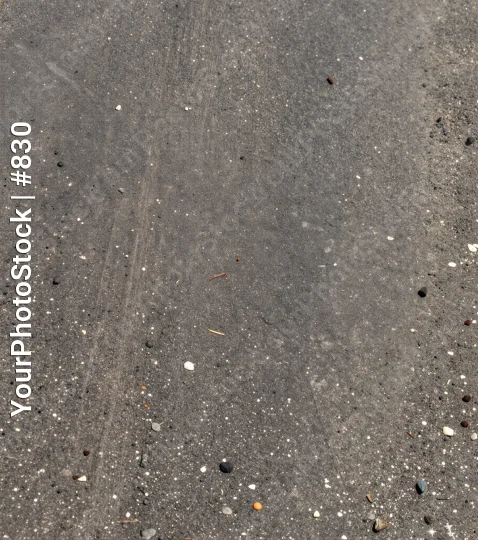 Wet Concrete Surface with Pebbles and Diagonal Line