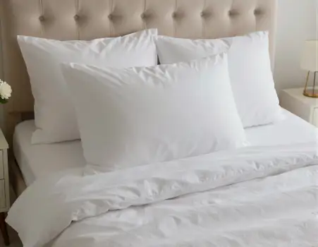 Bedroom with White Sheets and Plush Pillows tufted headboard hotel