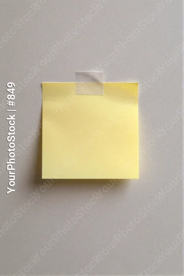 Minimalist Yellow Sticky Note on Gray Wall office
