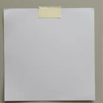 Yellow Sticky Note Attached to White Paper on Gray Wall