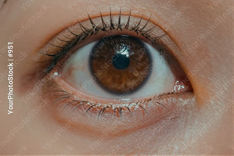 Close-up of a deep brown eye with blue center
