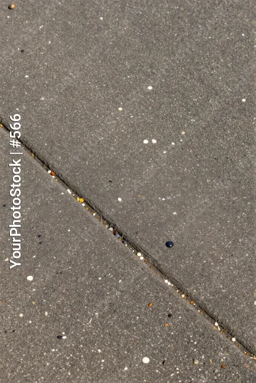 Wet Concrete Surface with Speckles and Pebbles
