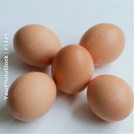 Five Fresh Light Brown Eggs on White Background