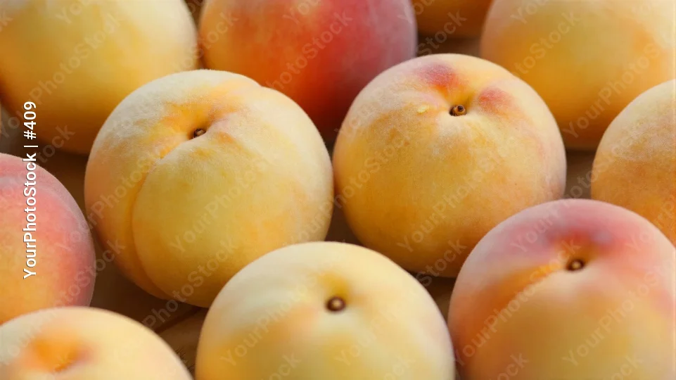 Ripe Peaches in a Pile fruit close-up arrangement