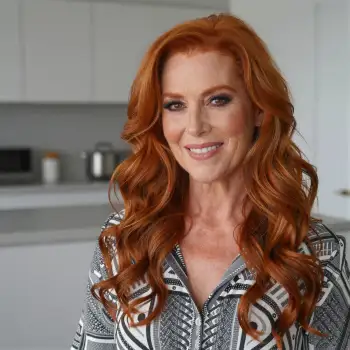 Smiling Woman with Red Hair in Kitchen portrait