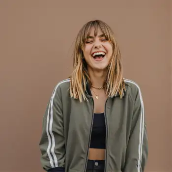 Young Woman Laughing in Playful Mood blonde hair