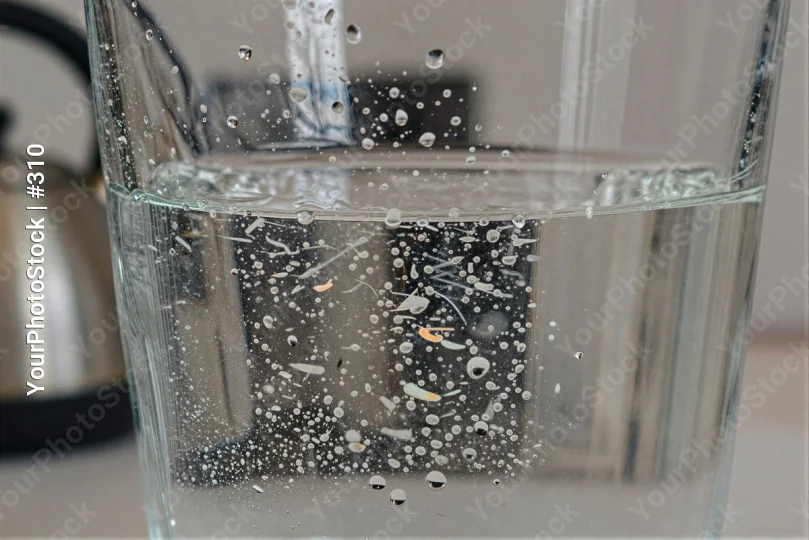 Pouring Water Into Glass With Bubbles faucet stream