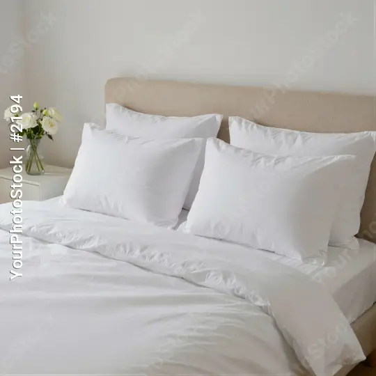 Bedroom with White Sheets and Pillows beige headboard hotel