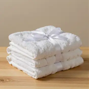 Neatly Folded White Towels on Wooden Surface neatly stacked hotel