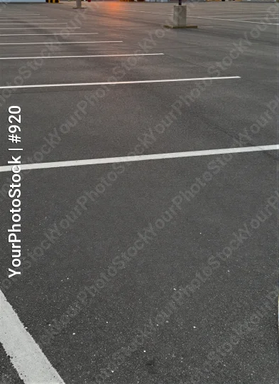 Empty Parking Lot with White Lines at Sunset lanes