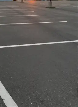 Empty Parking Lot with White Lines at Sunset lanes