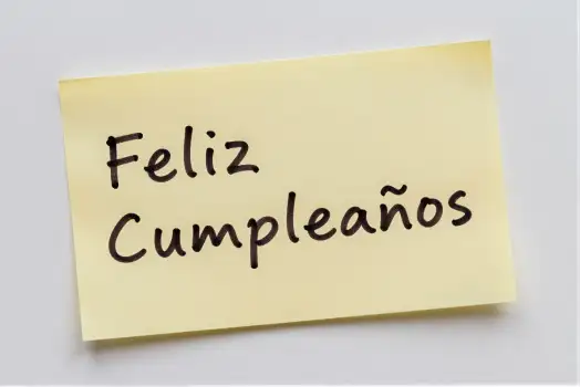 Yellow Sticky Note with 'Happy Birthday' Cursive Text