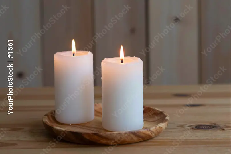 Lit White Candles on Wooden Plate lit candles