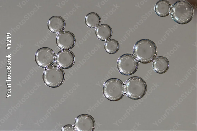 Group of Glass Objects on White Surface reflections