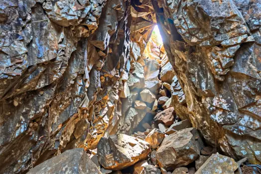 Rocky Cave Entrance with Bright Sunlight boulders