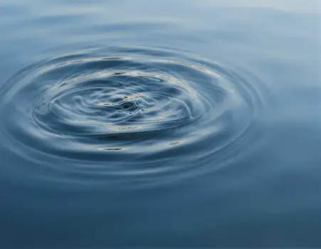 Calm Blue Water Surface with Spiral Pattern reflection