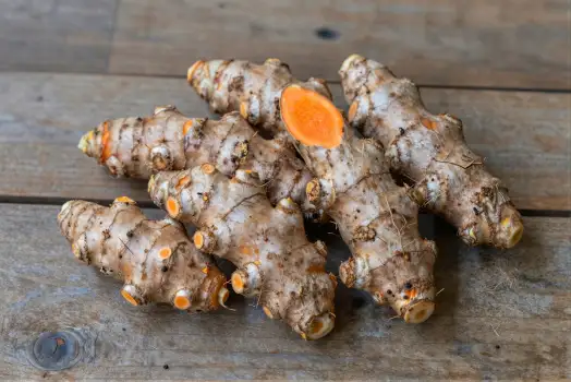 Fresh Ginger Root on Weathered Wood natural food