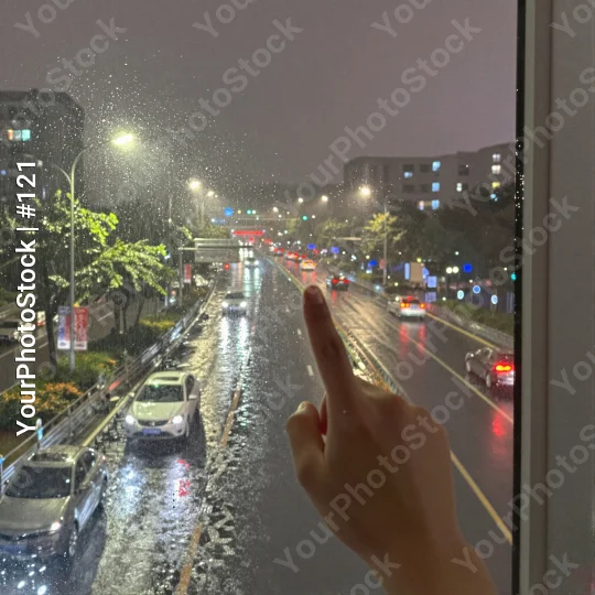 Busy Night Street View from Window rainy cars