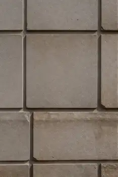 Close-up of Concrete Wall with Beige Tiles grid texture
